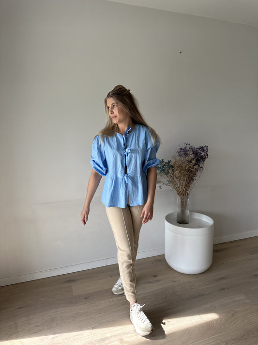 Blue tied cotton blouse